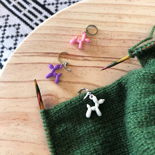 Metal knit stitch markers in the shape of balloon animals
